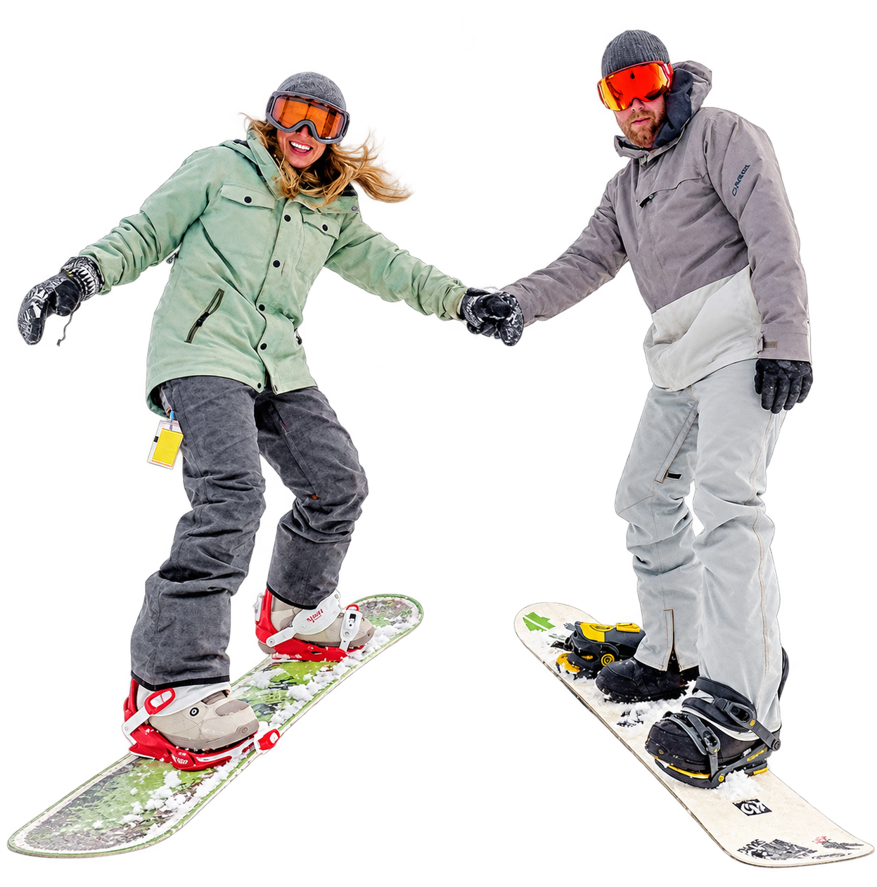 Two snowboarders holding hands as they dance on snow